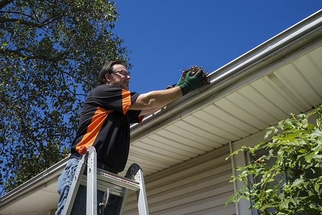 renovation expert repairing a damaged eavestrough in Albany, WI